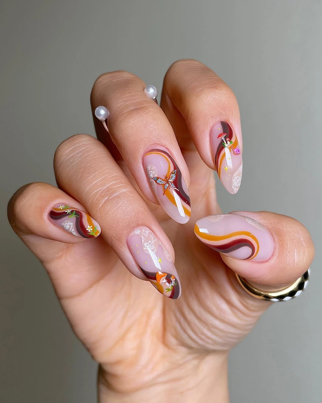 chic fall nails with autumn designs - Warm Autumn Swirls With Tiny Seasonal Details