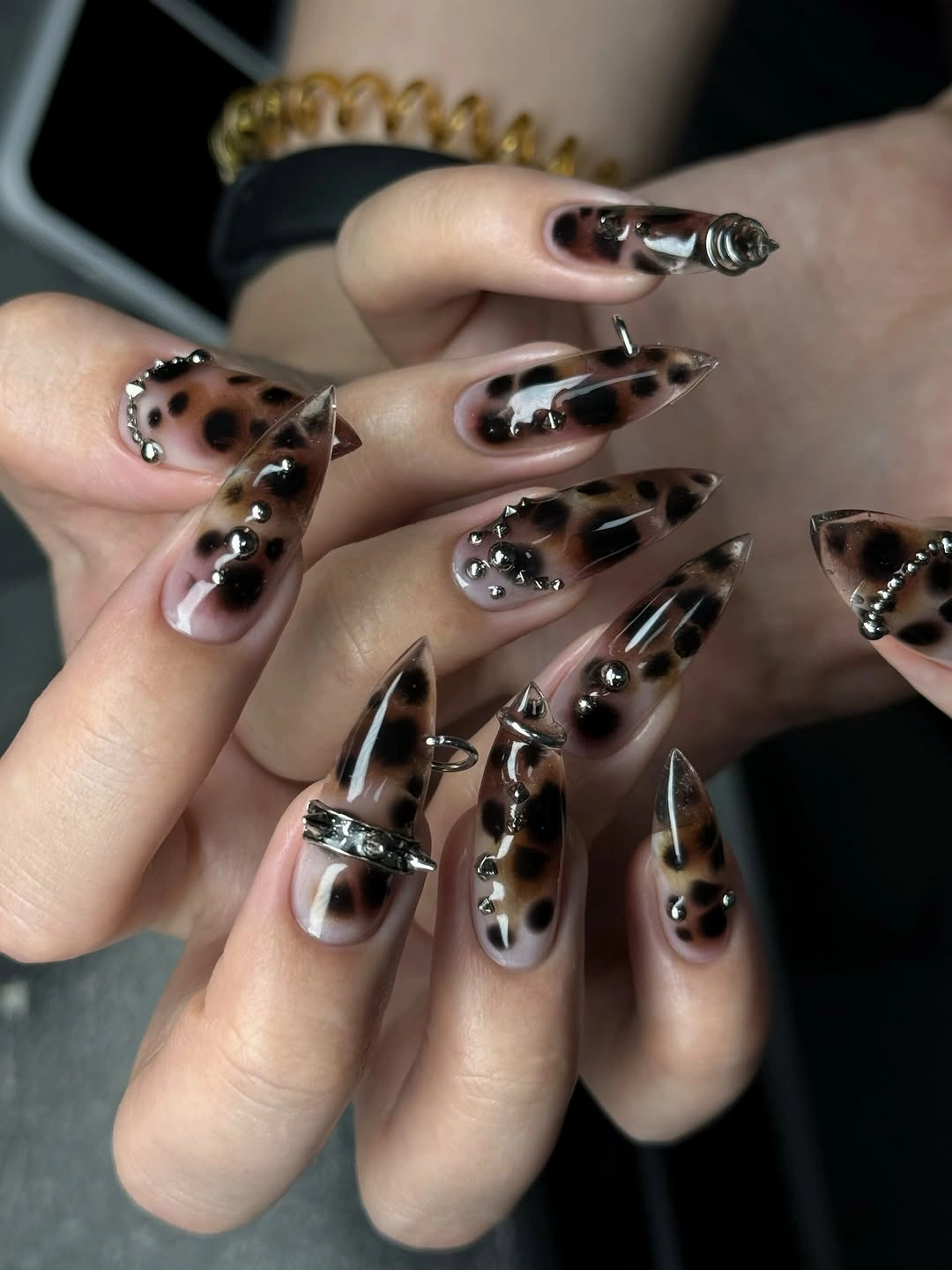 chic fall trendy nails 2026 Sheer Leopard Stiletto Nails With Chrome Charms