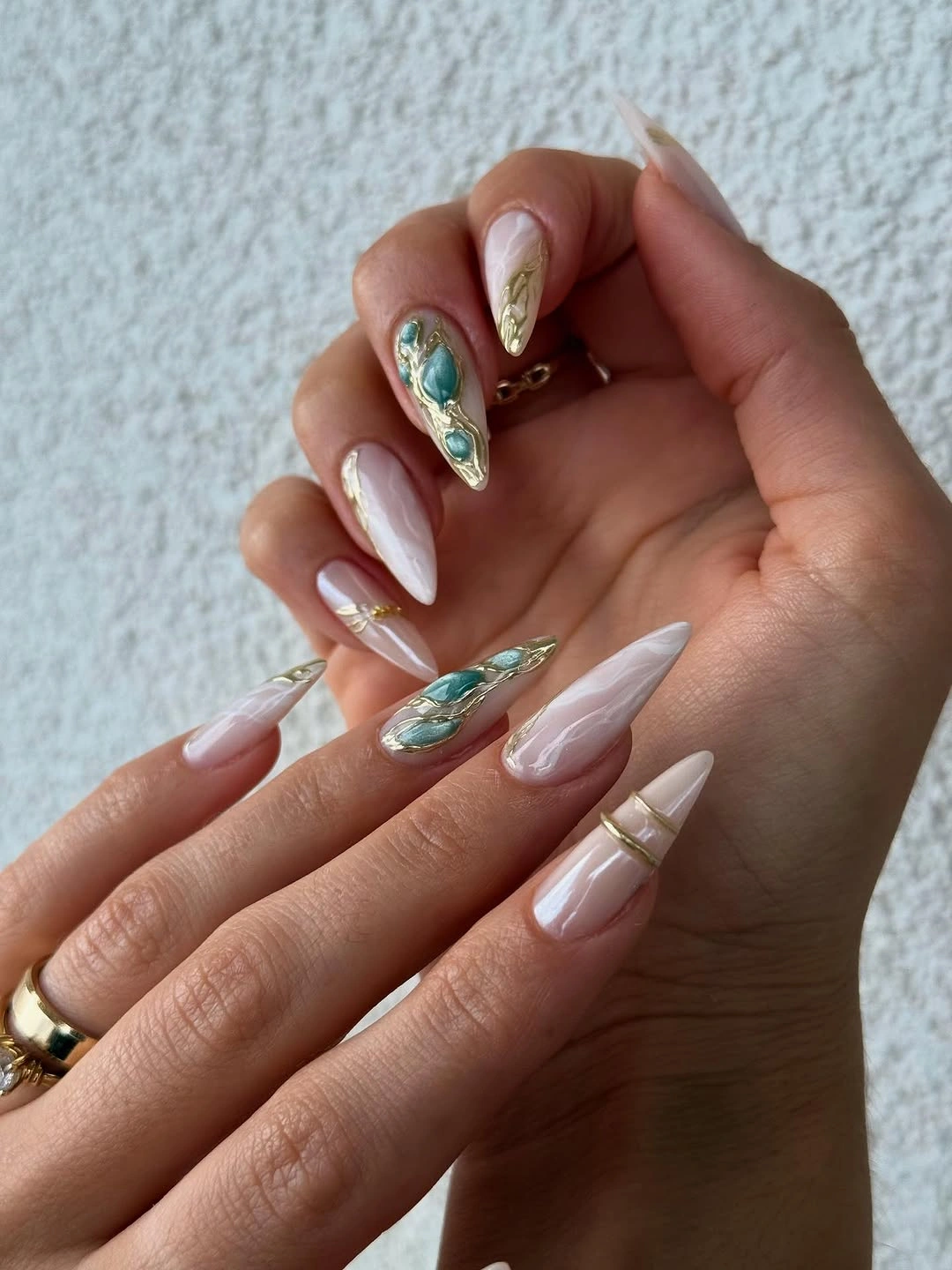 chic fall trendy nails 2026 Milky Nails With Turquoise and Gold Gemstone Details