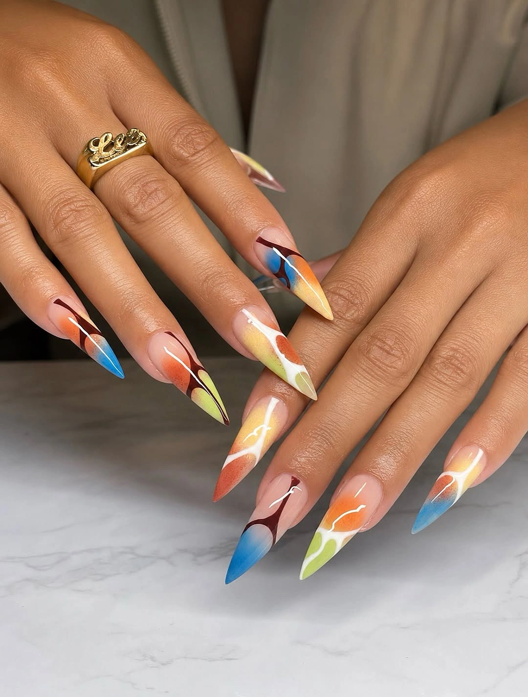 chic fall trendy nails 2026 Colorful Abstract Stiletto Nails for an Unexpected Fall Twist