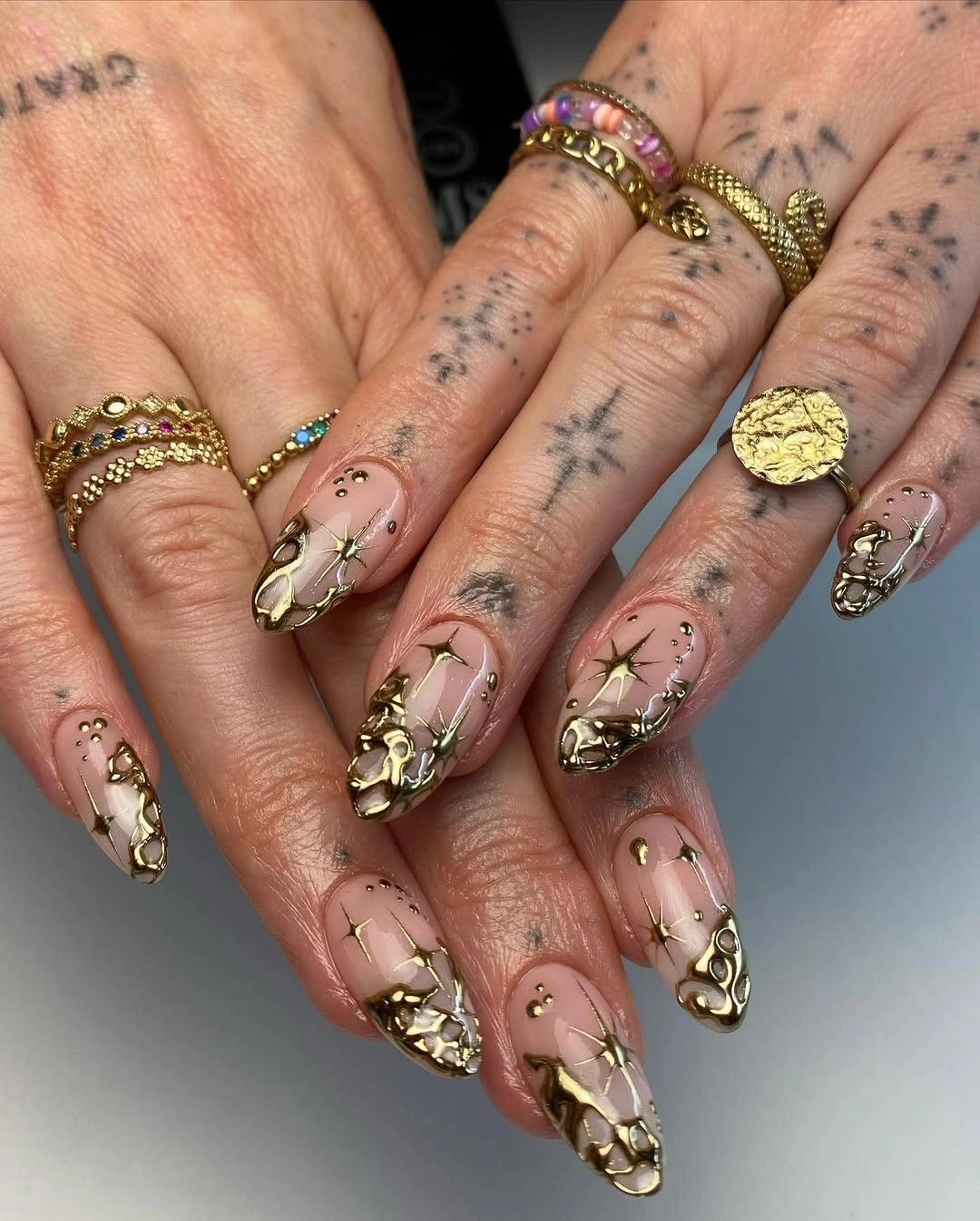 chic fall trendy nails 2026 Gold Filigree and Nude Chrome for a Luxe Fall Manicure