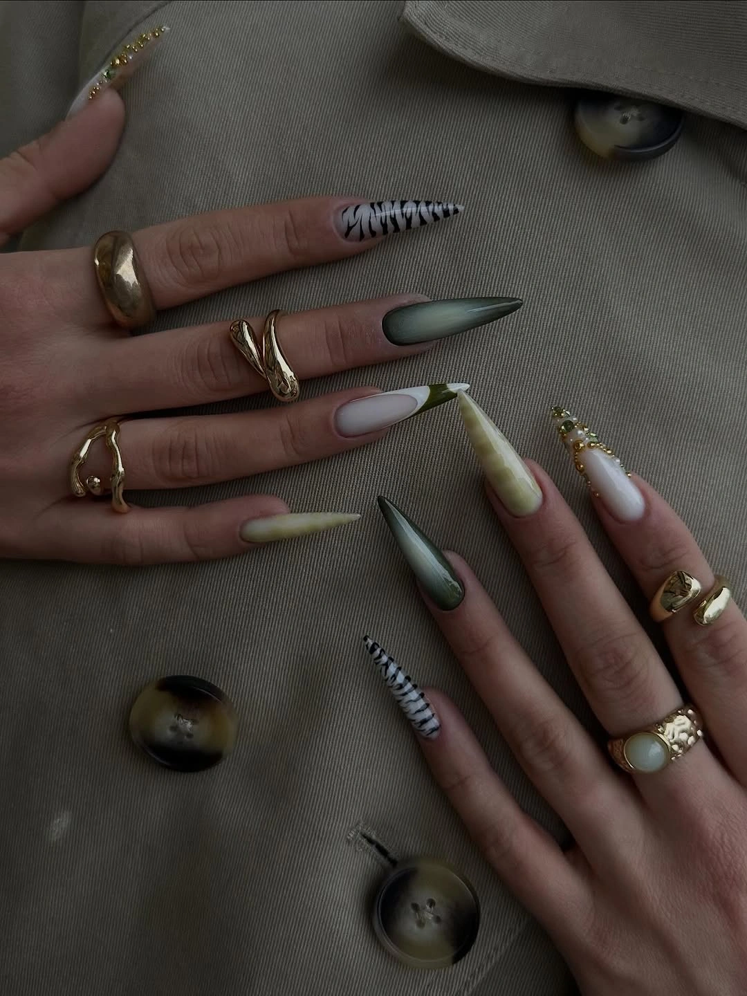chic fall trendy nails 2026 Moody Green Almond Nails With Gold and Zebra Details
