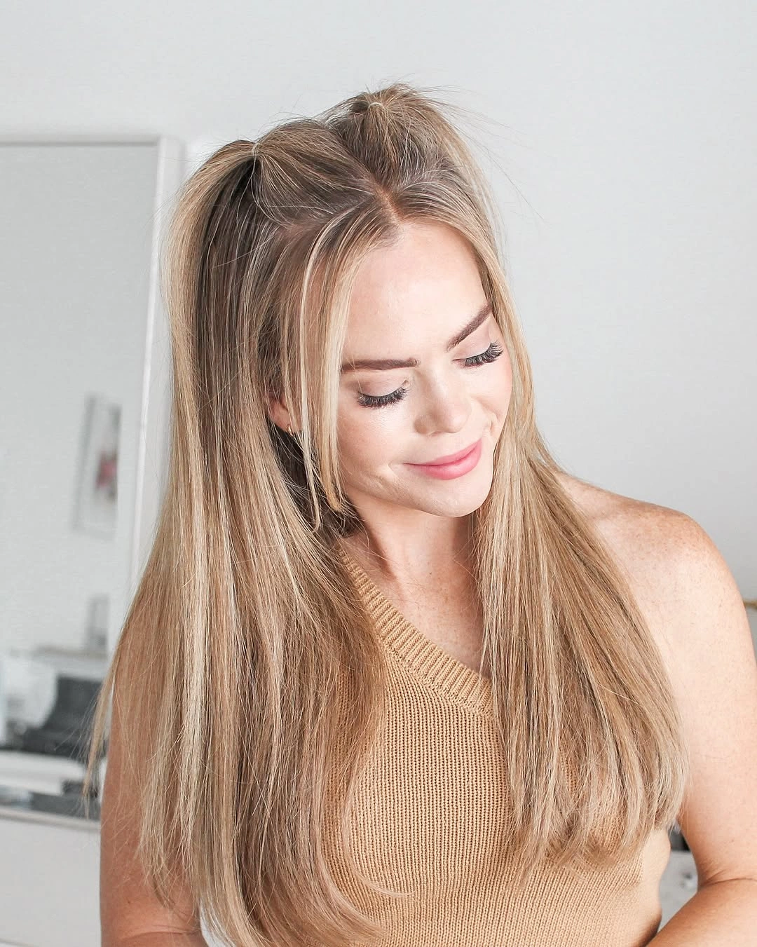 chic middle parting hairstyles - Blonde Half-Up Style With Face-Framing Pieces