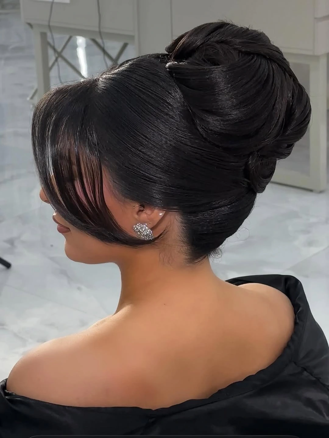 chic middle parting hairstyles - Elegant black sculpted updo