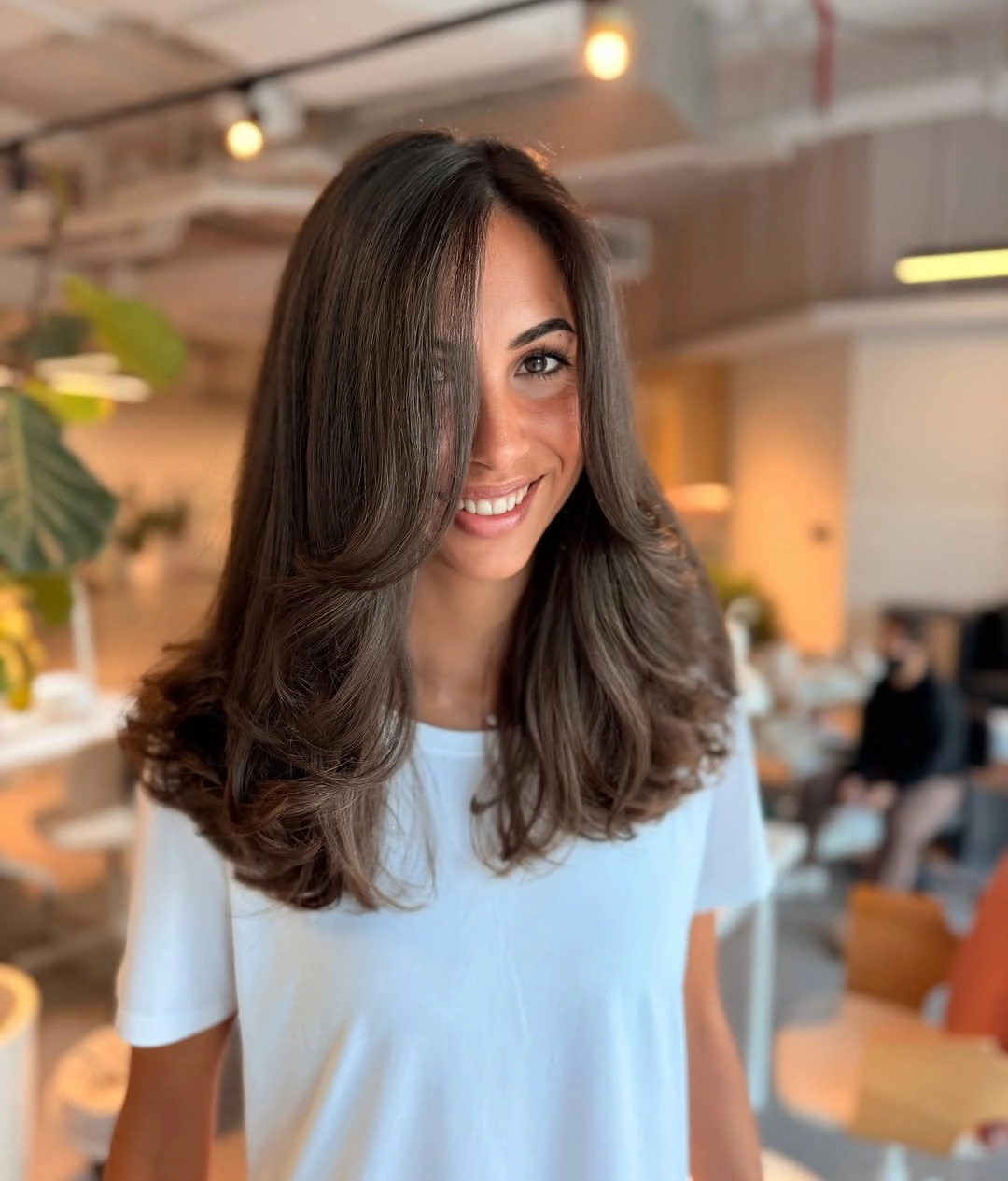 chic middle parting hairstyles - Soft brunette layered waves