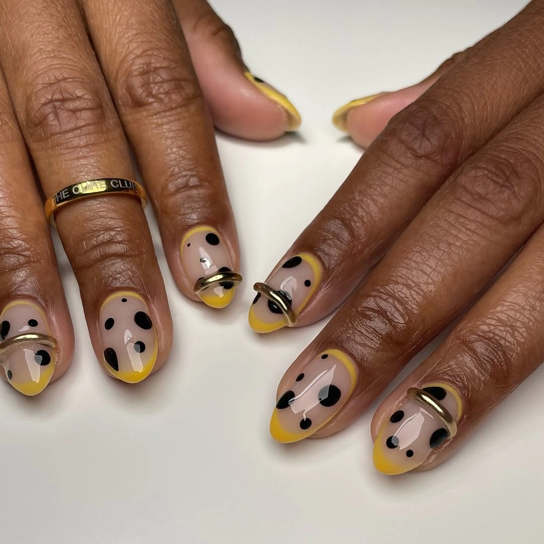 chic polka dot fall nails 2026 yellow French tips with black dots