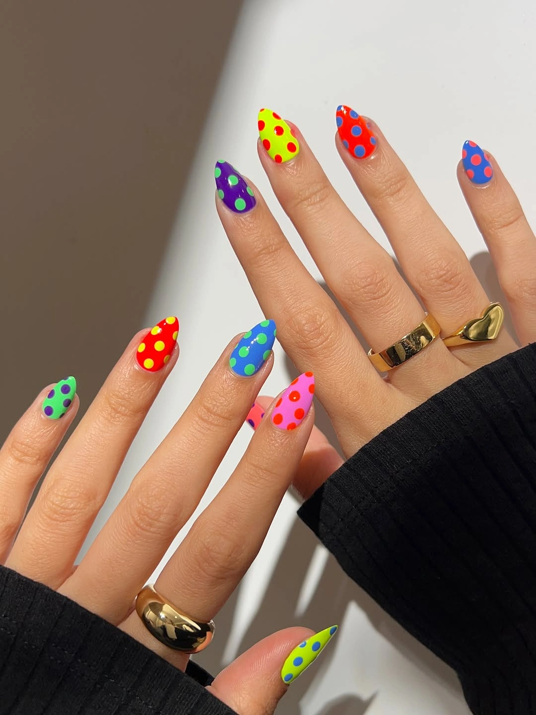 chic polka dot fall nails 2026 bright multicolor almond nails