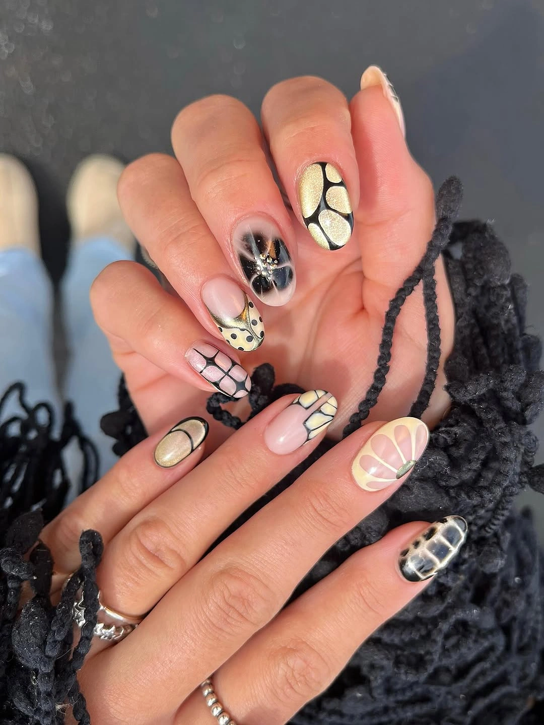 elegant fall short almond nails 2026 Abstract Gold and Black Nail Art That Turns into Jewelry