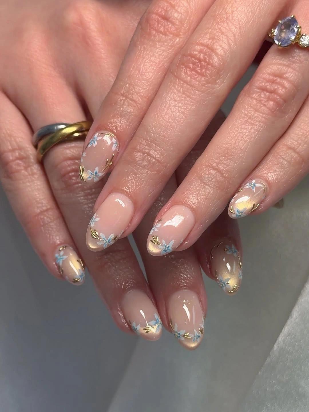 elegant fall short almond nails 2026 Delicate Blue Floral French Tips