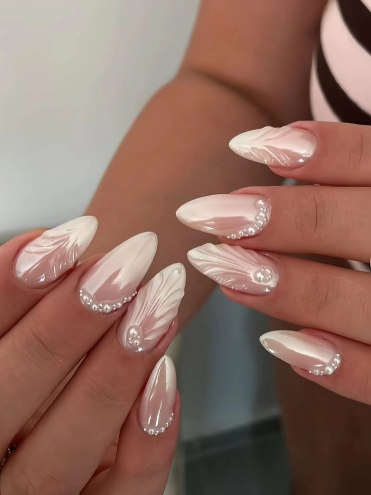 elegant fall wedding nails 2026 Soft Pearl Chrome with Delicate Feather Accents