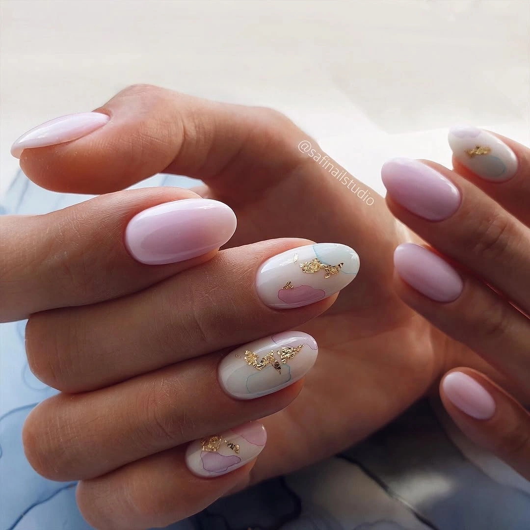 Elegant nude fall nails 2026 with pastel pink and gold abstract art
