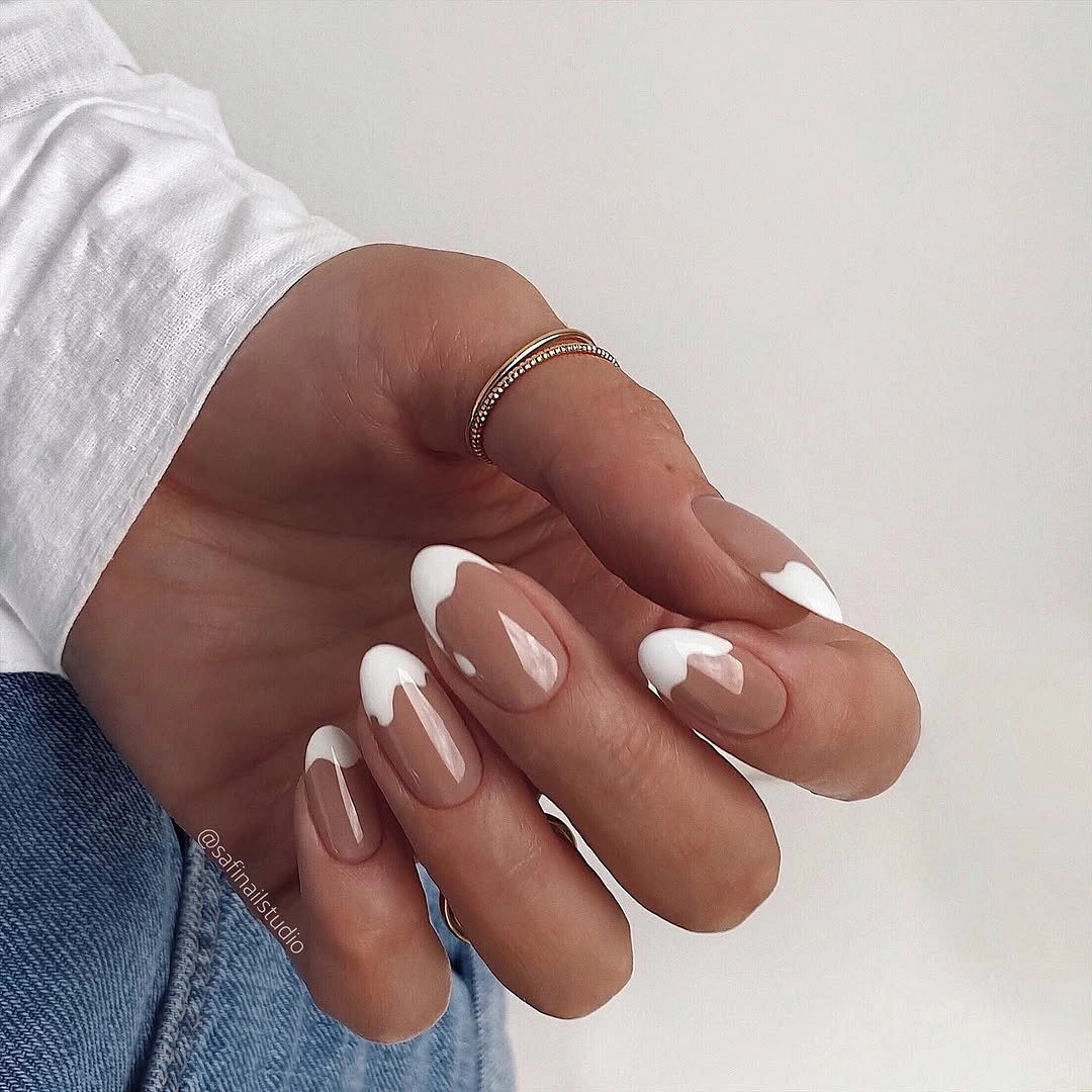 Elegant nude fall nails 2026 with soft white French tips