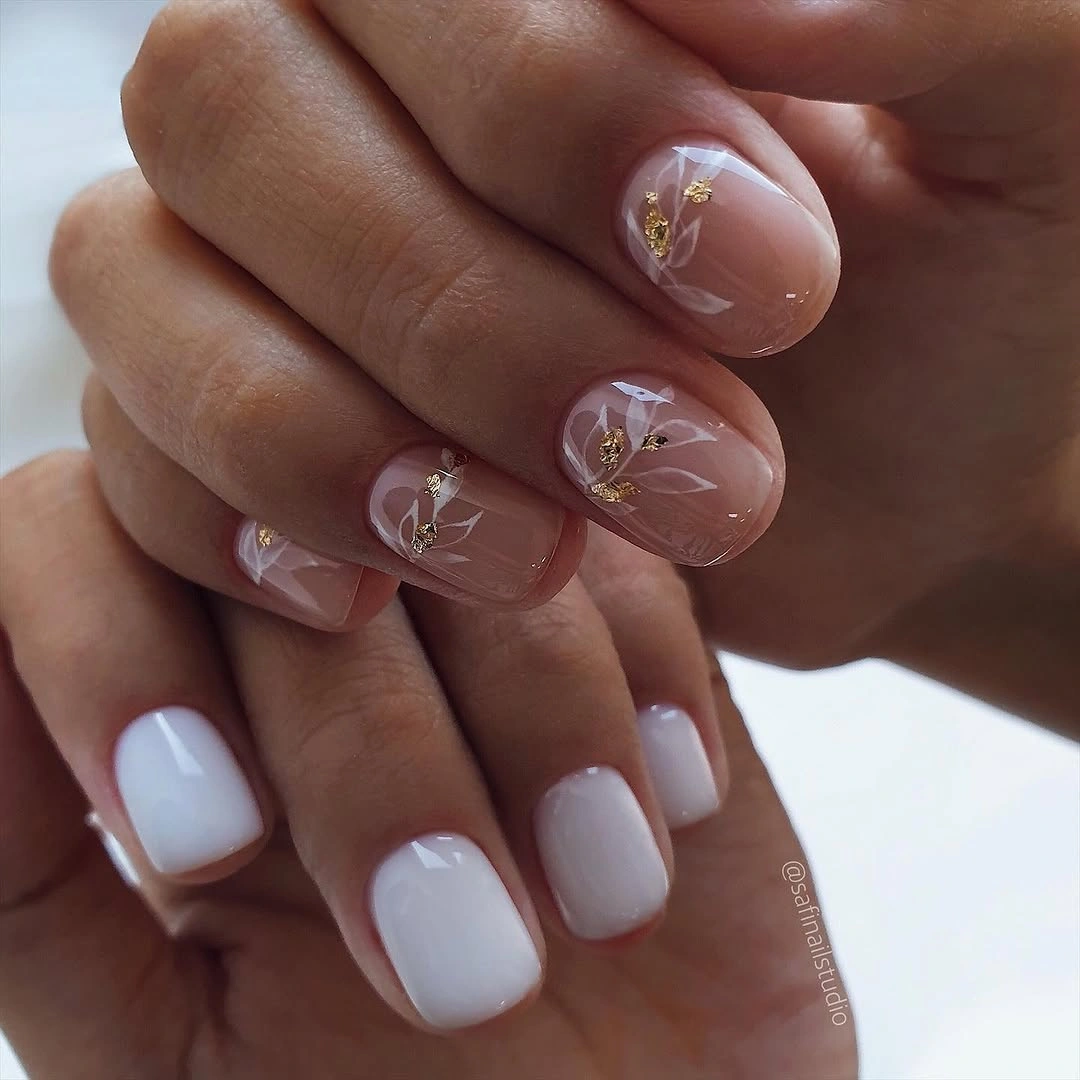 Elegant nude fall nails 2026 with sheer botanical gold details