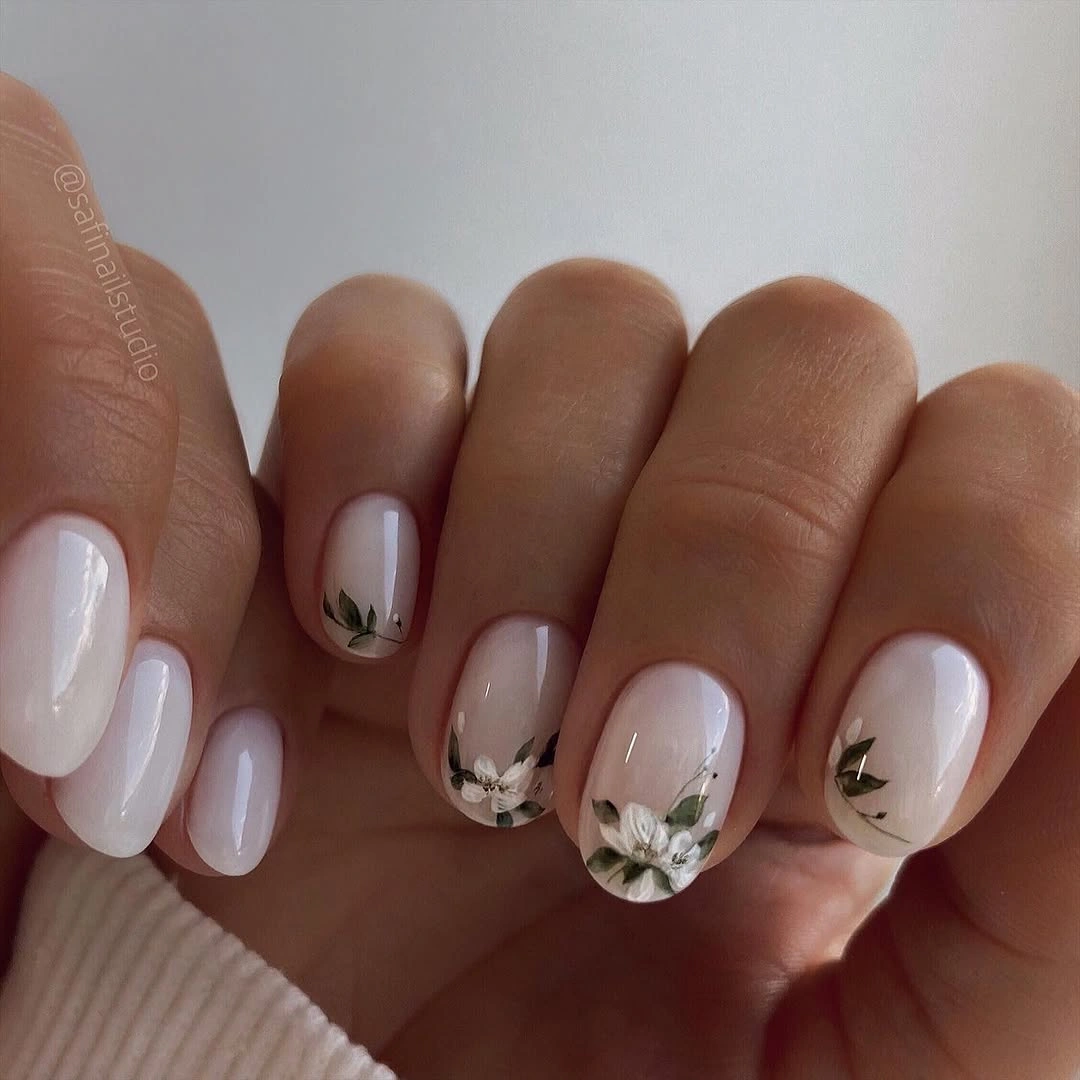 Elegant nude fall nails 2026 with white floral details