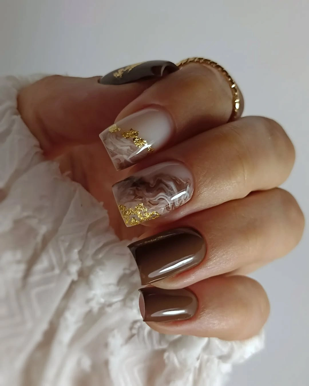 gorgeous dark fall nails 2026 - Chocolate Marble Nails With Gold Foil Details