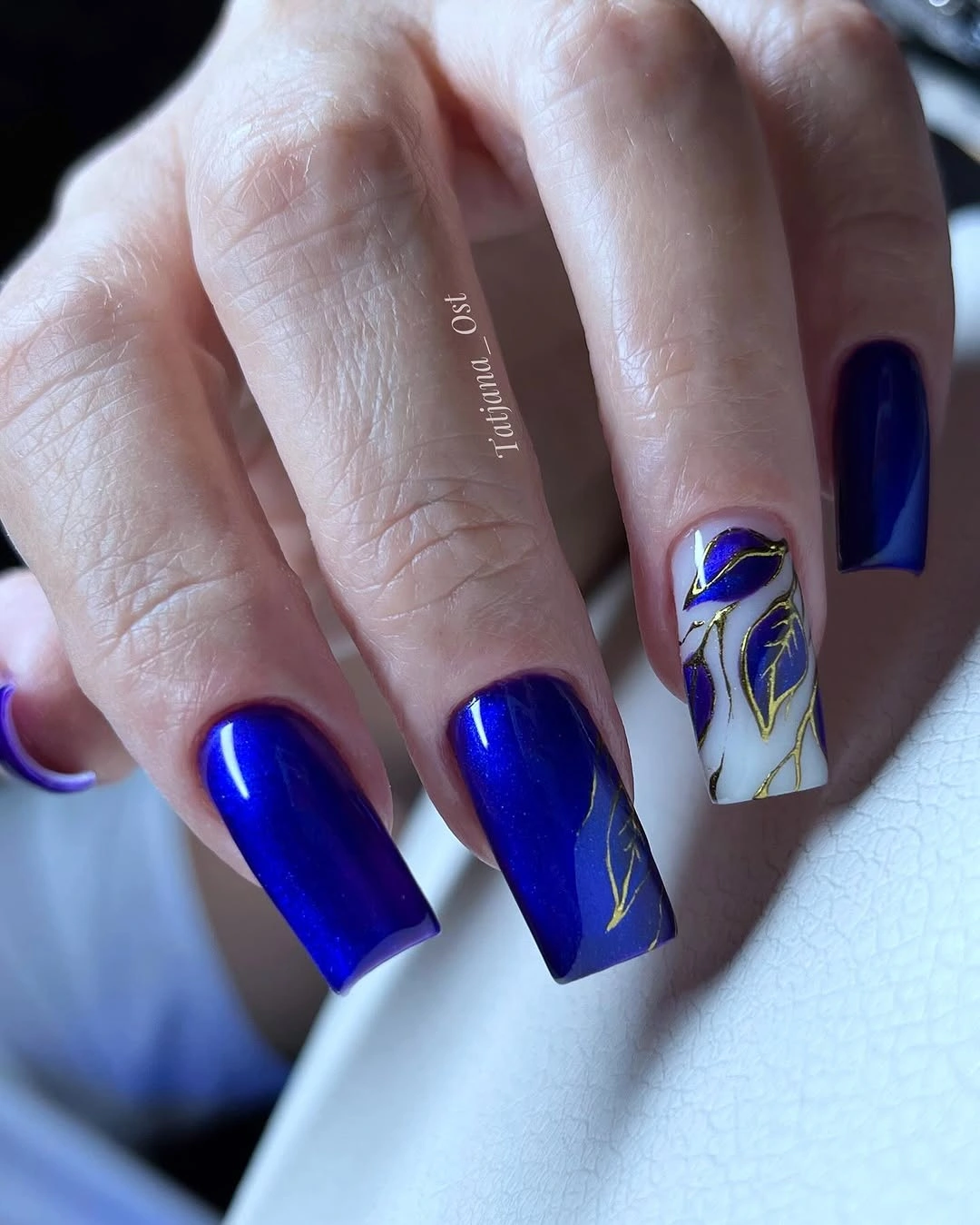 gorgeous dark fall nails 2026 cobalt blue gel nails with gold marble art