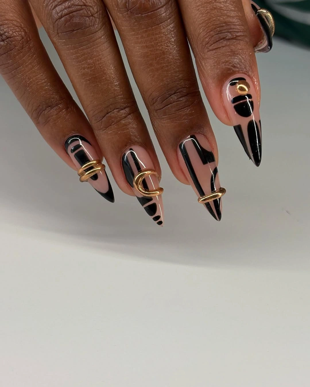 rich fall nails colors for dark skin Black and Gold Graphic Nails With Jewelry-Like Details