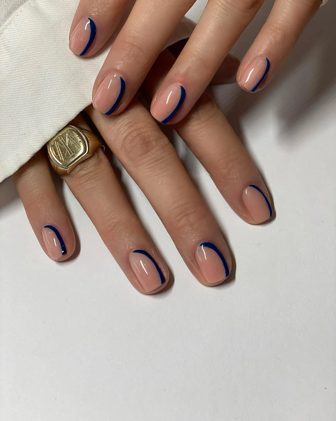 rich fall nails colors for dark skin Cobalt Blue Outline on a Soft Nude Base