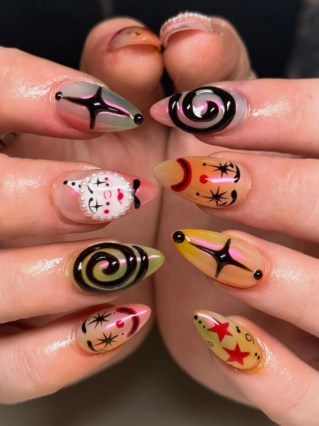 spooky halloween nails designs 2026 retro orange black swirl Halloween nails