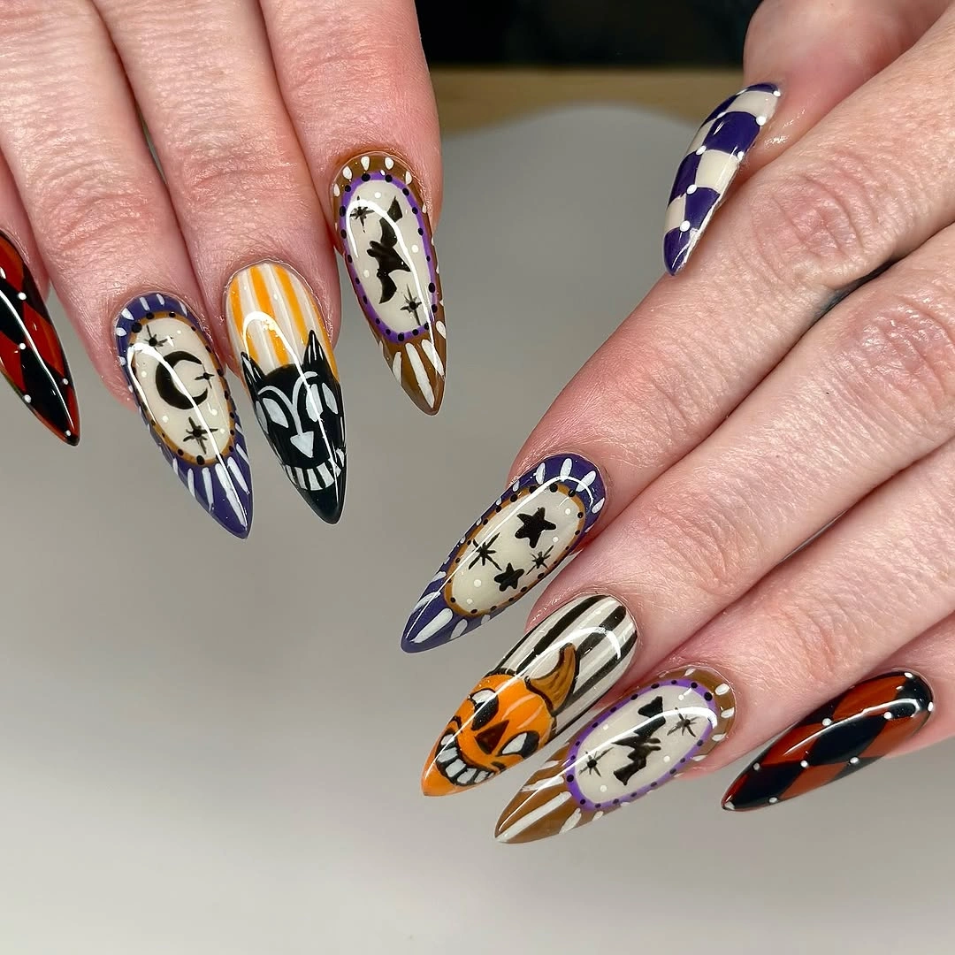 spooky halloween nails designs 2026 purple orange patchwork Halloween almond nails