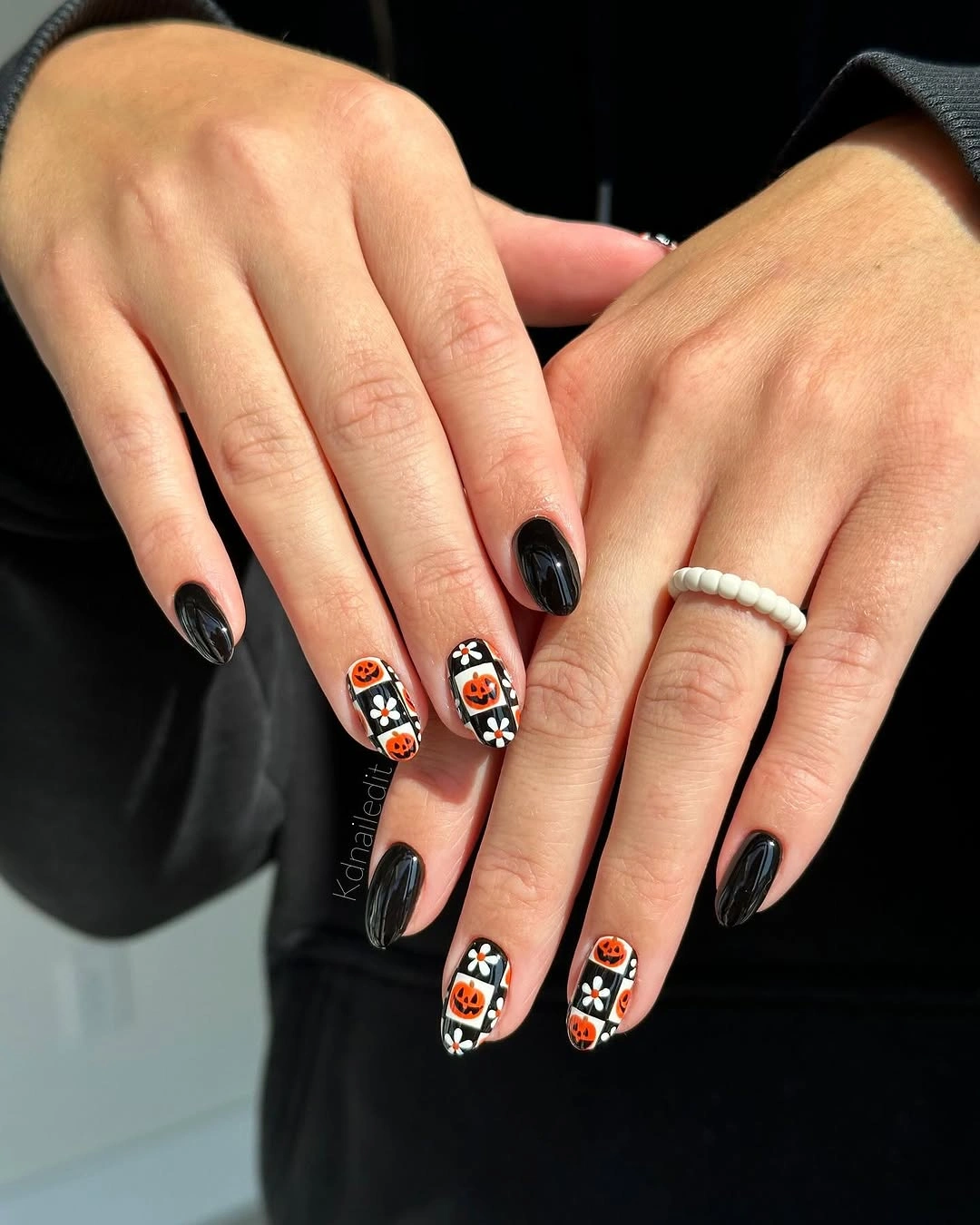 spooky halloween nails designs 2026 black orange pumpkin checkerboard nails