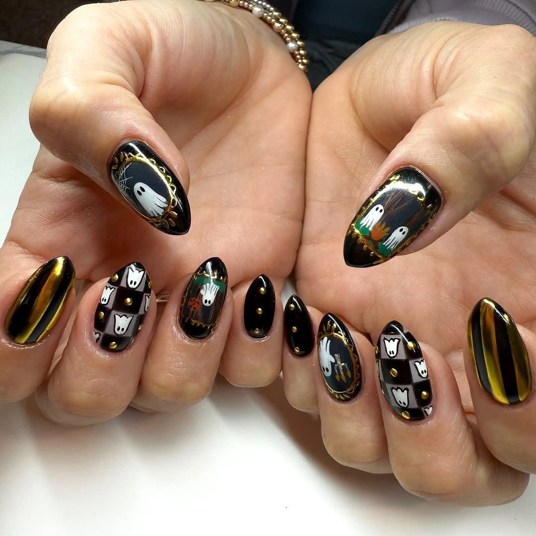 spooky halloween nails designs 2026 black and gold ghost Halloween manicure