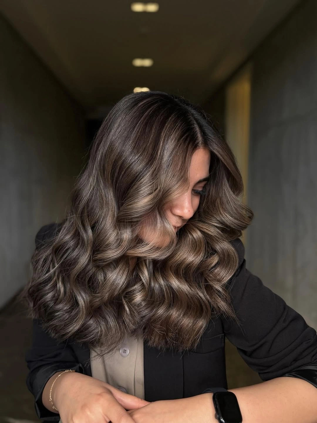 stunning fall brown hair colour ideas 2026 Glossy Mocha Waves with Soft Face-Framing Dimension