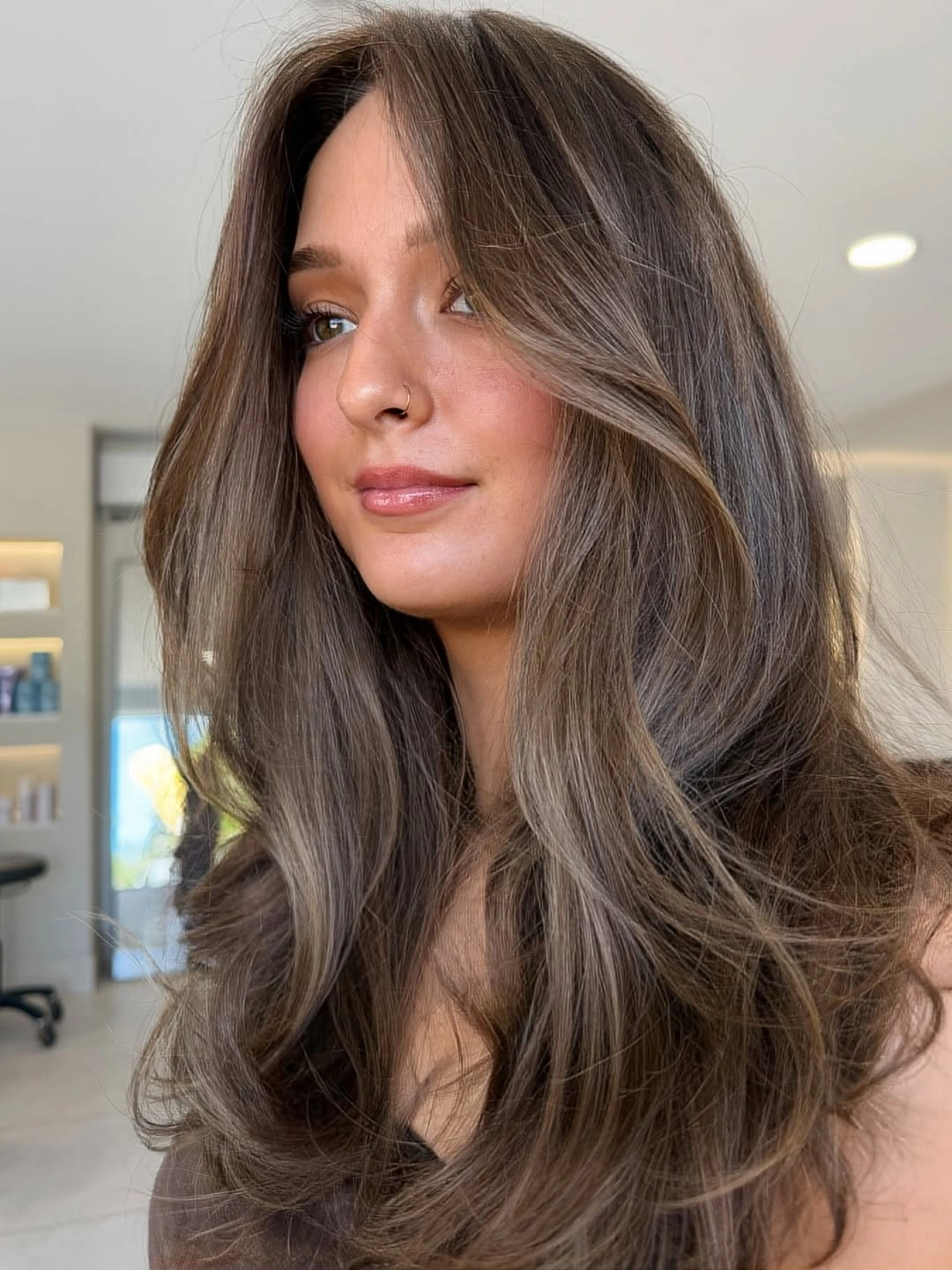 stunning fall brown hair colour ideas 2026 Cool Mushroom Brown with Airy Curtain Layers