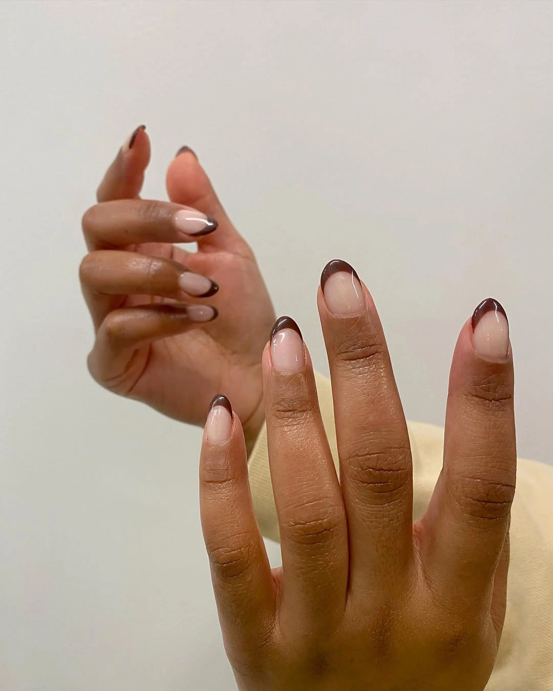 stunning fall nails for dark skin 2026 Chocolate French Tips with a Soft Nude Base