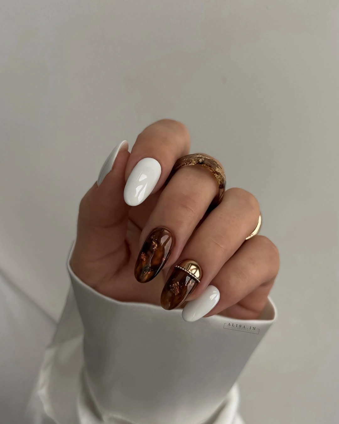 stylish autumn nails color - Chocolate Brown and Cream With a Glossy Luxe Finish