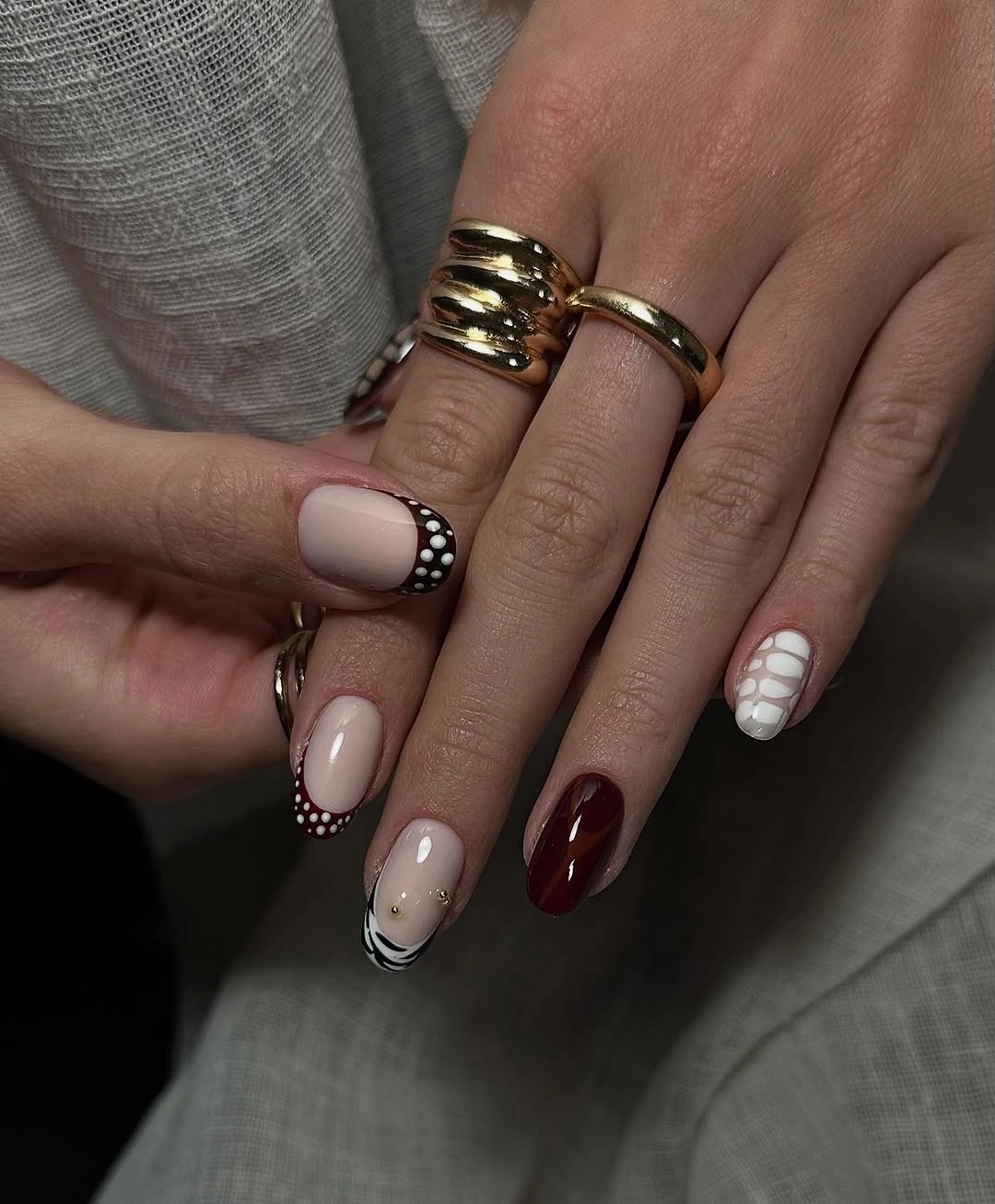 stylish autumn nails color - Muted fall mix with burgundy and graphic details