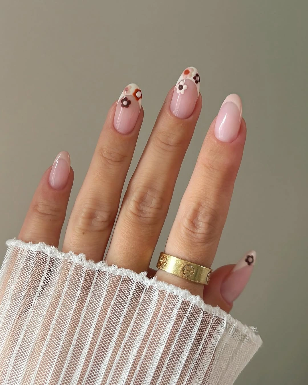 stylish autumn nails color - Soft pink manicure with tiny autumn florals
