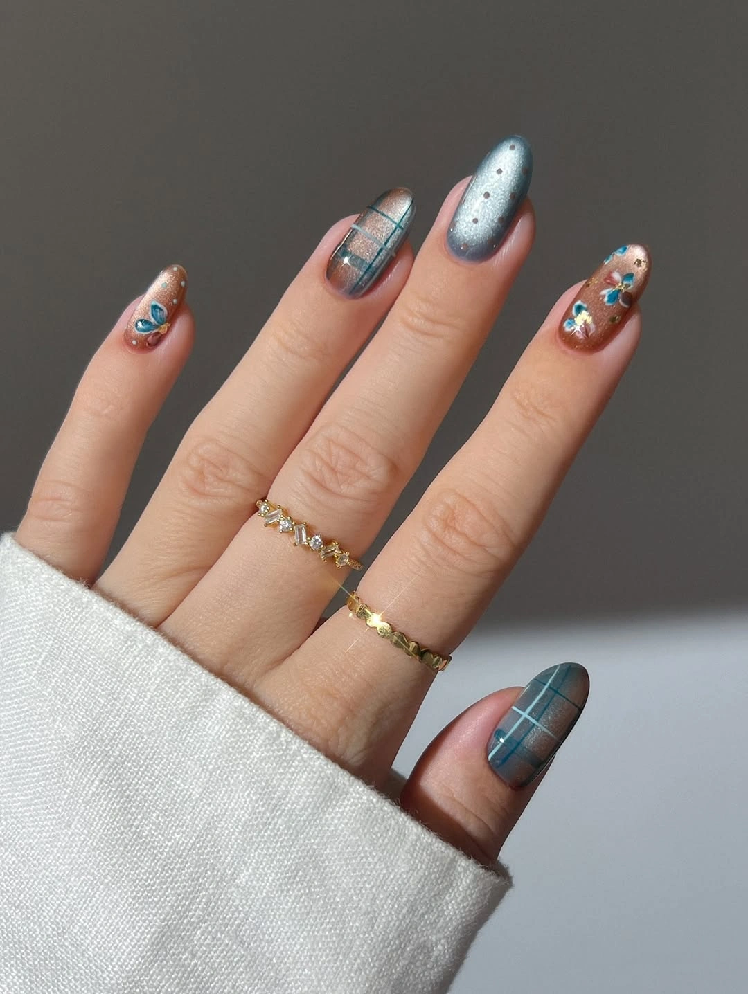 Stylish Fall Nail Trends 2026 Soft Blue Plaid Nails With Floral Details