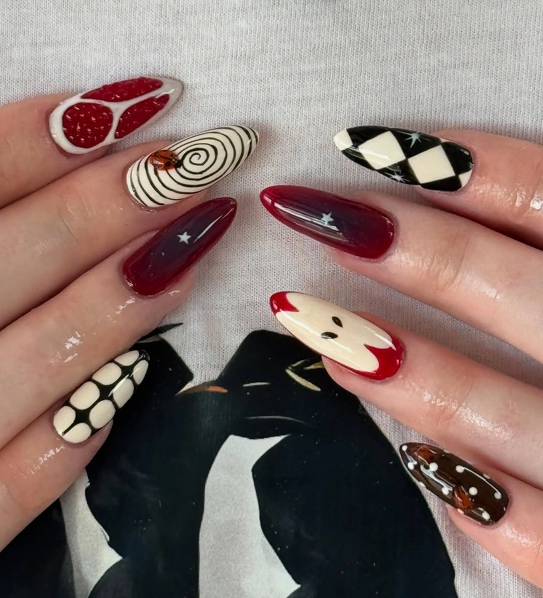 stylish fall nail trends 2026 Playful Red Storybook Nails with Whimsical Autumn Art