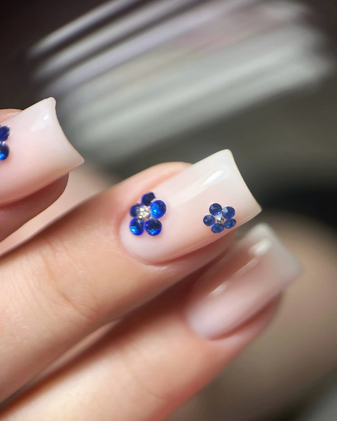 stylish fall nails for fair skin tones 2026 Blue Crystal Flowers on a Milky Base