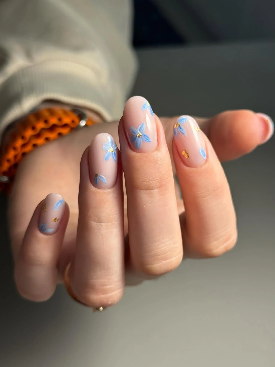 stylish fall nails for fair skin tones 2026 Blue Floral Nails With Golden Accents