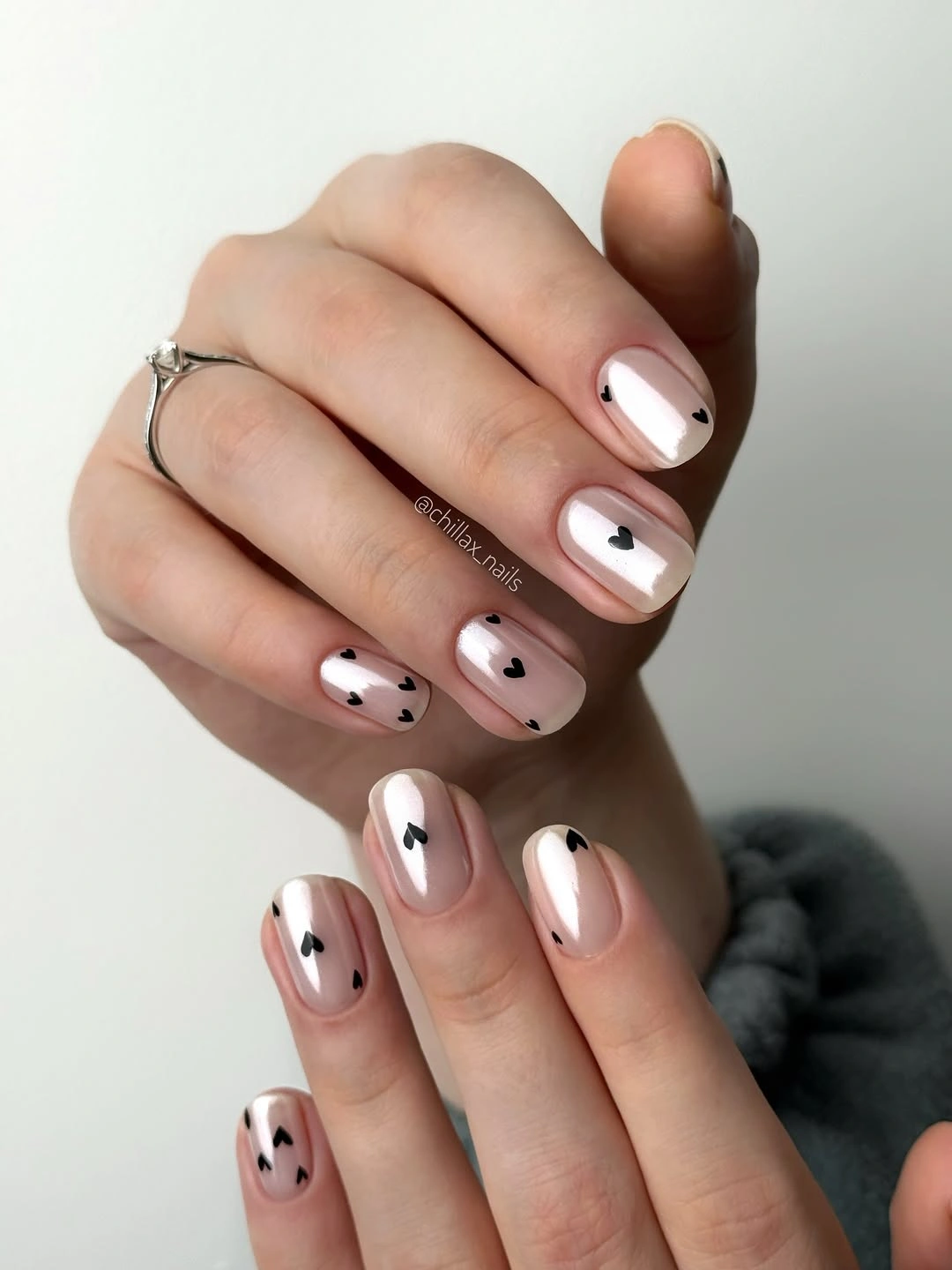 stylish fall nails for fair skin tones 2026 Black Heart Accents on Pearly Pink