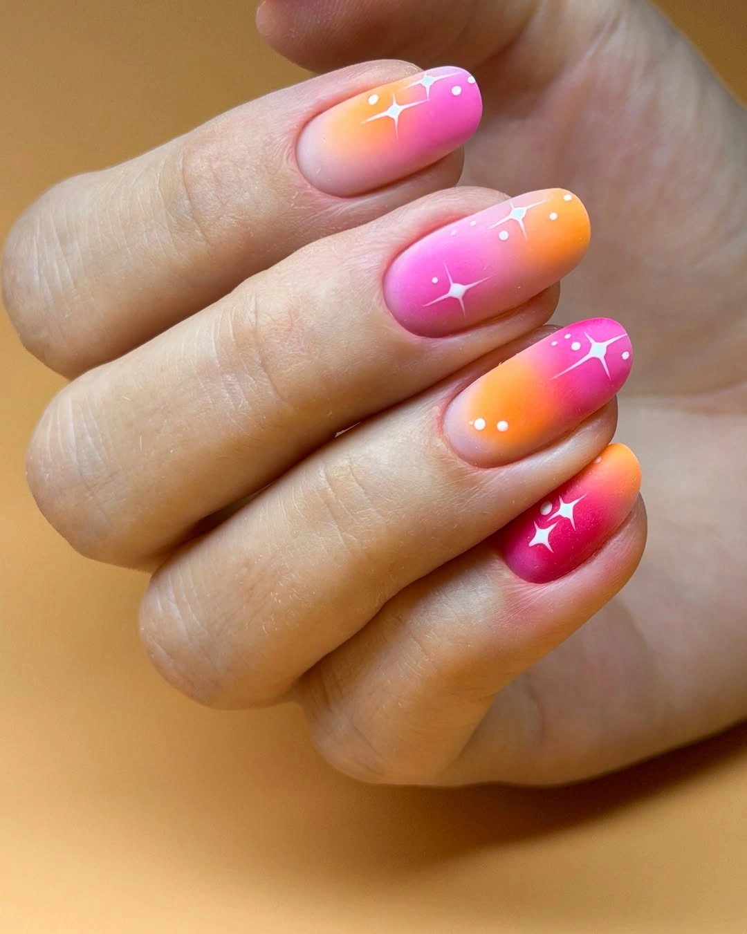 stylish fall nails for fair skin tones 2026 Pink and Orange Sunset Nails