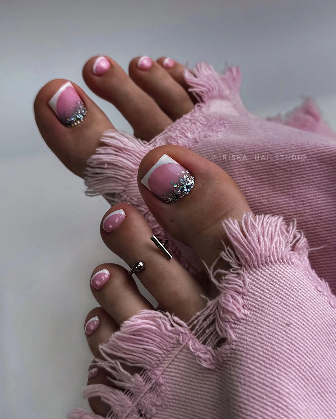 stylish fall toe nails colors 2026 - Soft Pink French Pedicure With Silver Sparkle