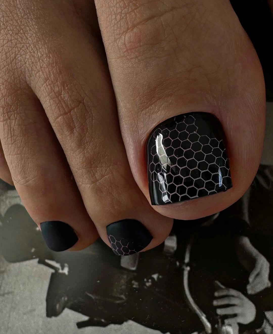 stylish fall toe nails colors 2026 - Glossy Black Pedicure With Honeycomb Detail