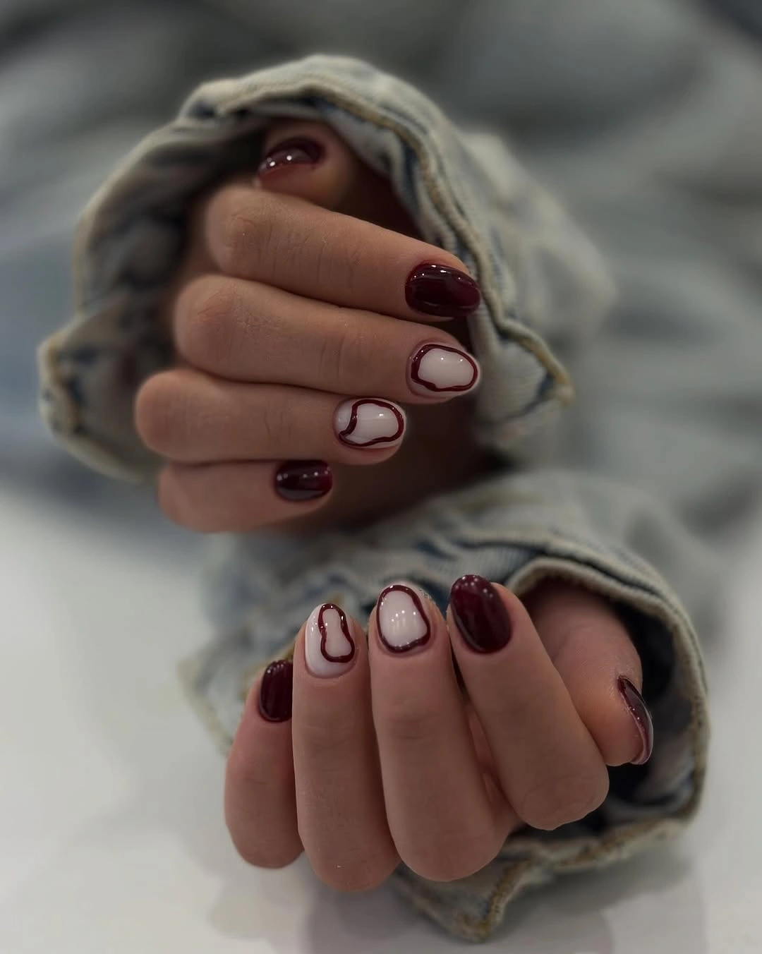 stylish maroon fall nails 2026 Short Burgundy Nails With Soft Negative Space