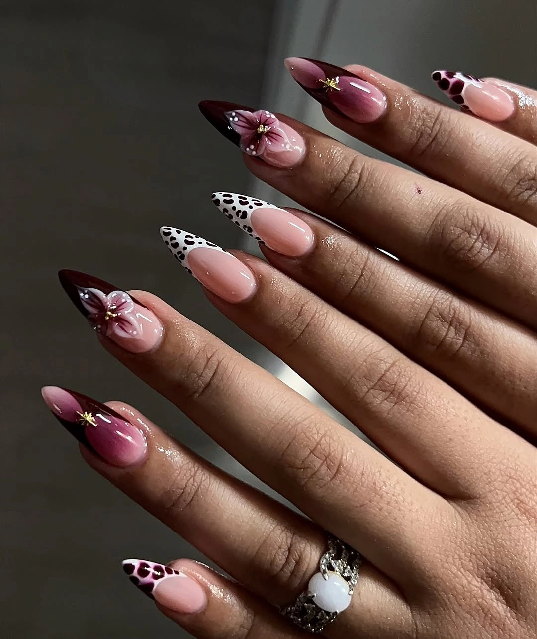 stylish maroon fall nails 2026 Burgundy Almond Nails With Leopard And Floral Accents