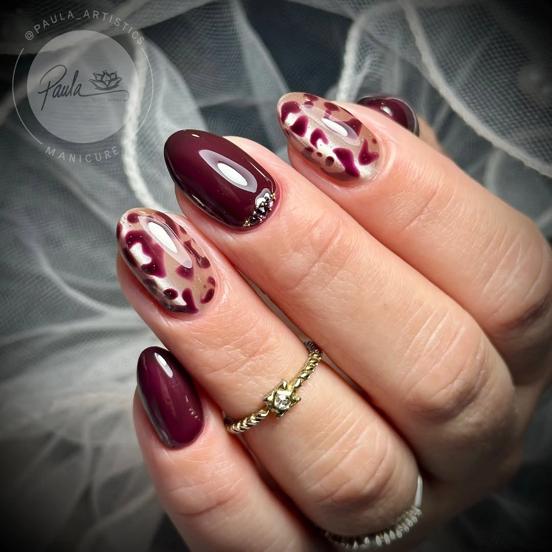 stylish maroon fall nails 2026 Burgundy Almond Nails With Nude And Soft Floral Details