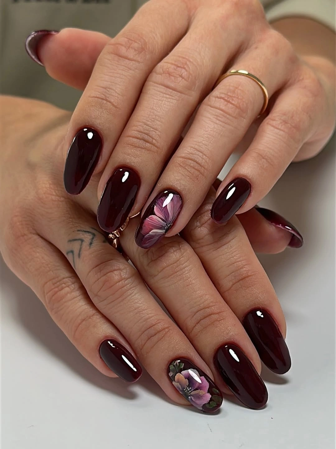 stylish maroon fall nails 2026 Burgundy Nails With Delicate Floral Accents