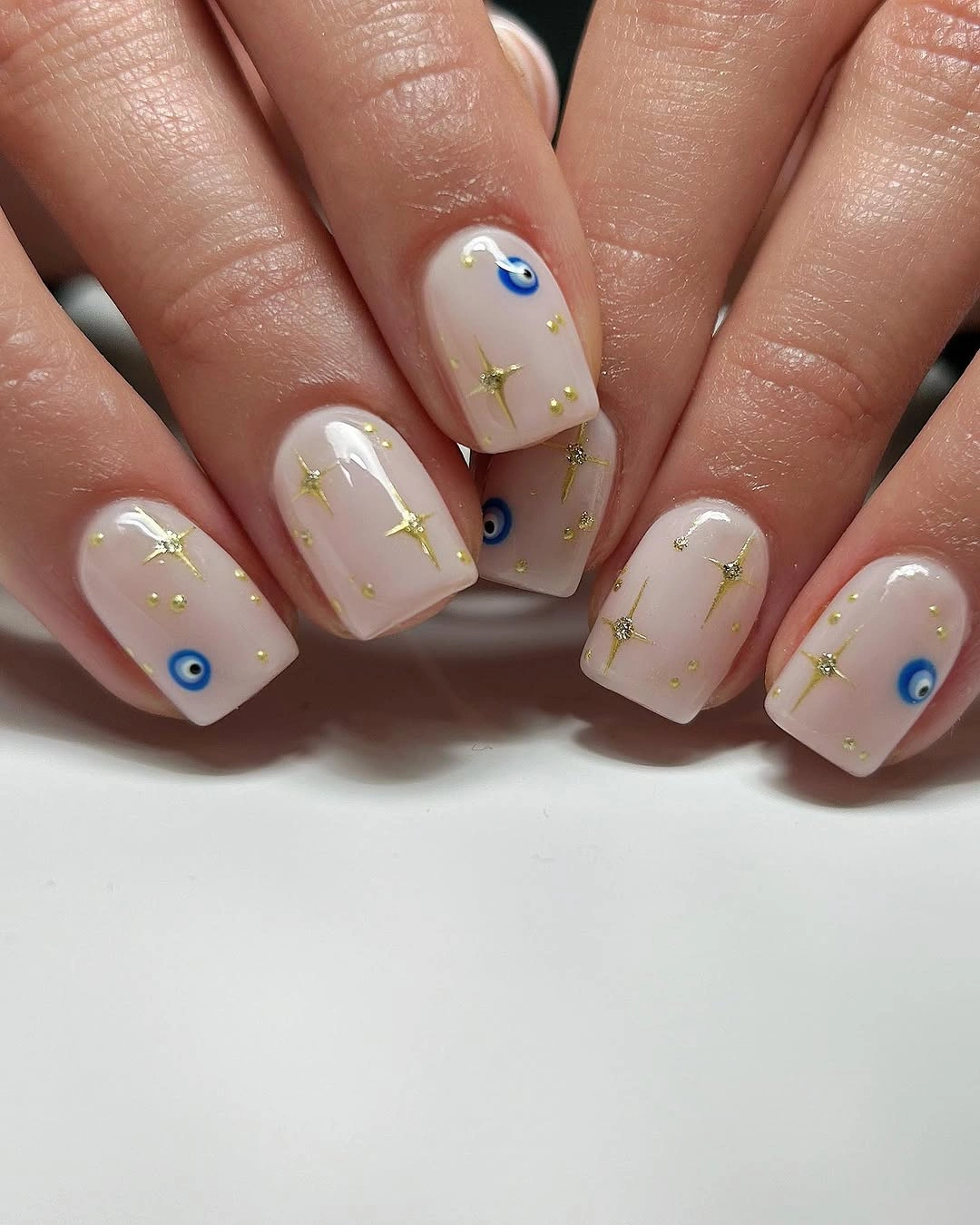 stylish simple fall short nails - Milky White Nails with Blue and Gold Details