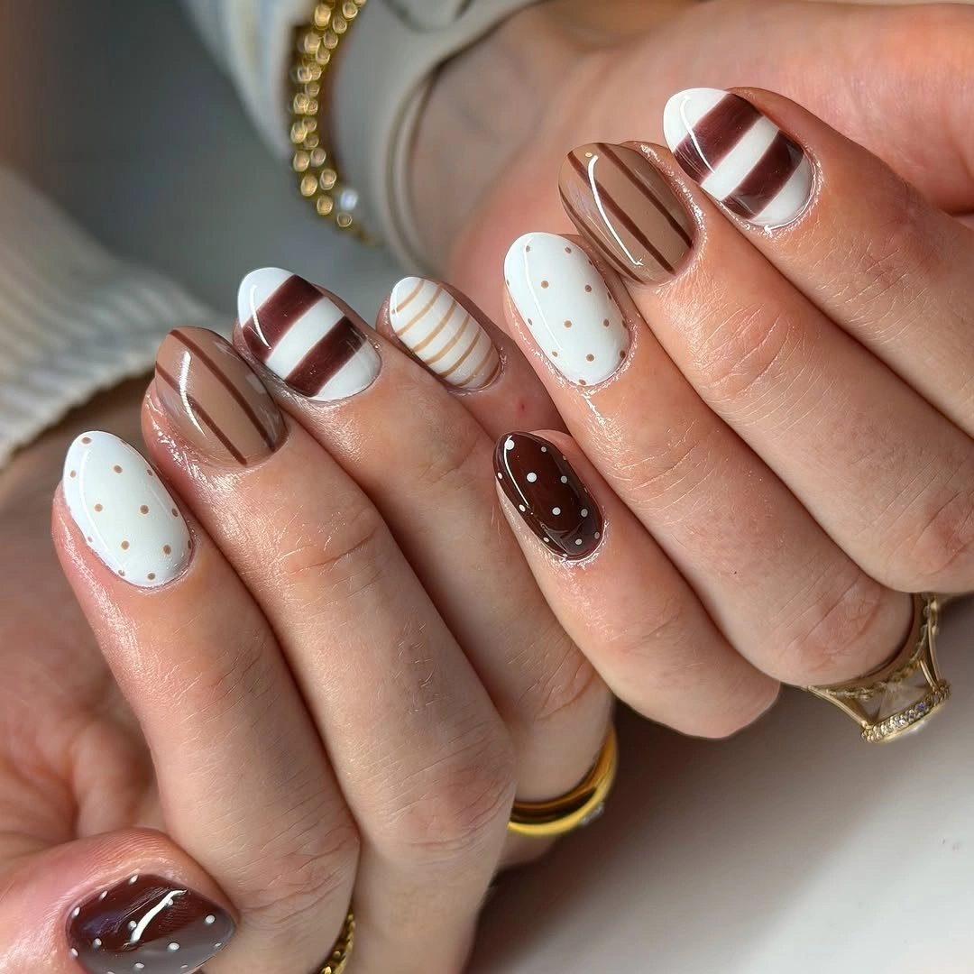 trendy brown fall nails 2026 Mocha Mix-and-Match Nails with Polka Dots and Graphic Stripes