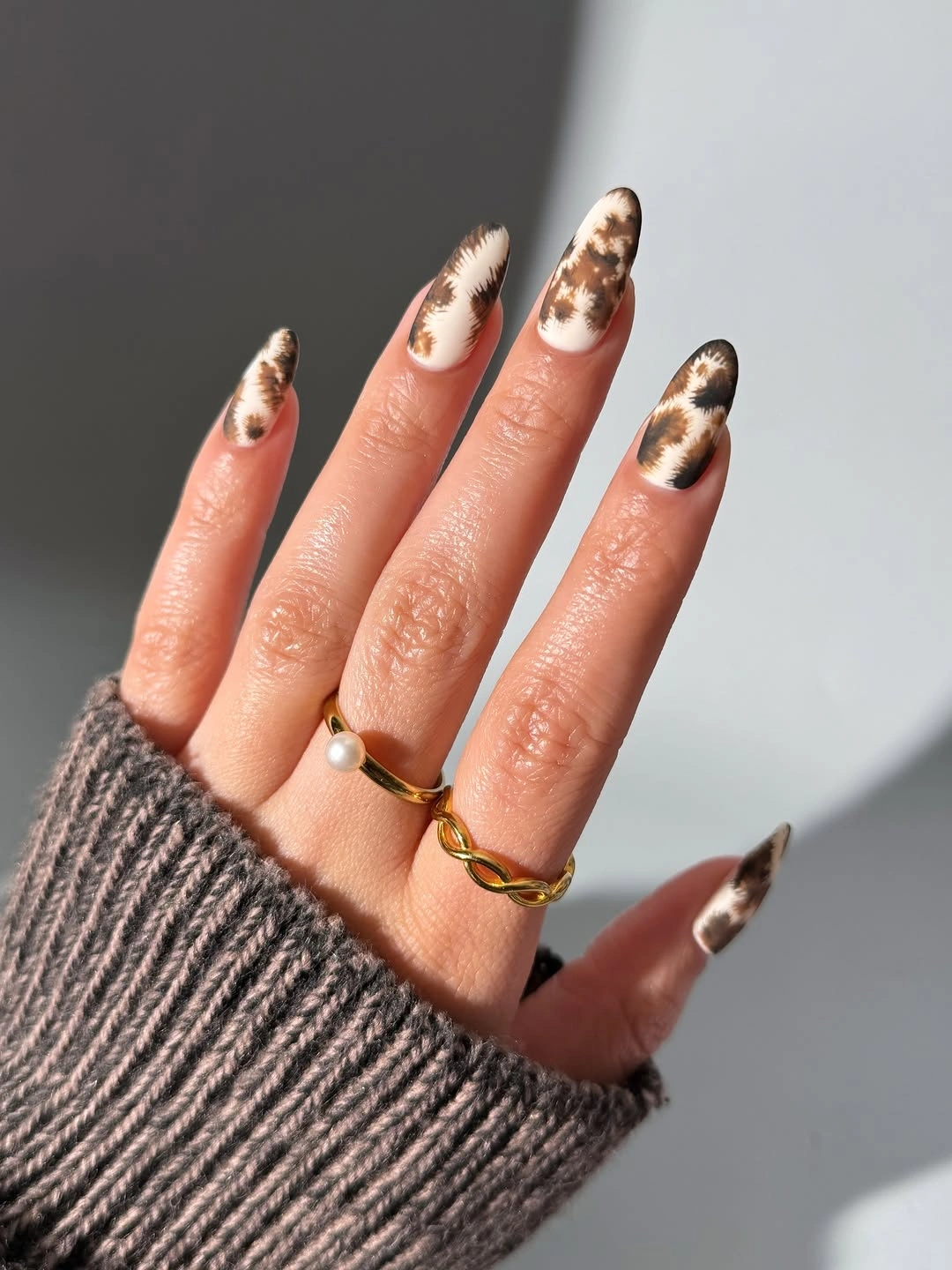 trendy brown fall nails 2026 Soft Animal Print Nails in Cream and Chocolate Tones