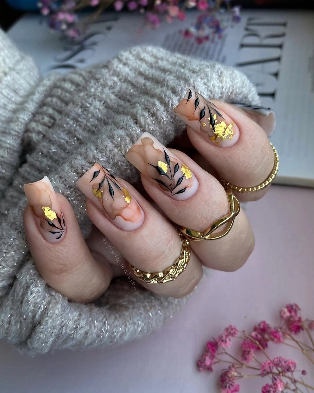 trendy fall acrylic nails 2026 Elegant Neutral Marble with Black Botanical Details