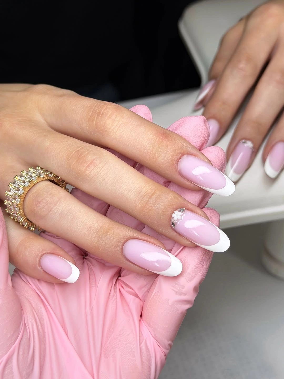 trendy fall french nails 2026 Classic Almond French with Tiny Floral Crystal Accent
