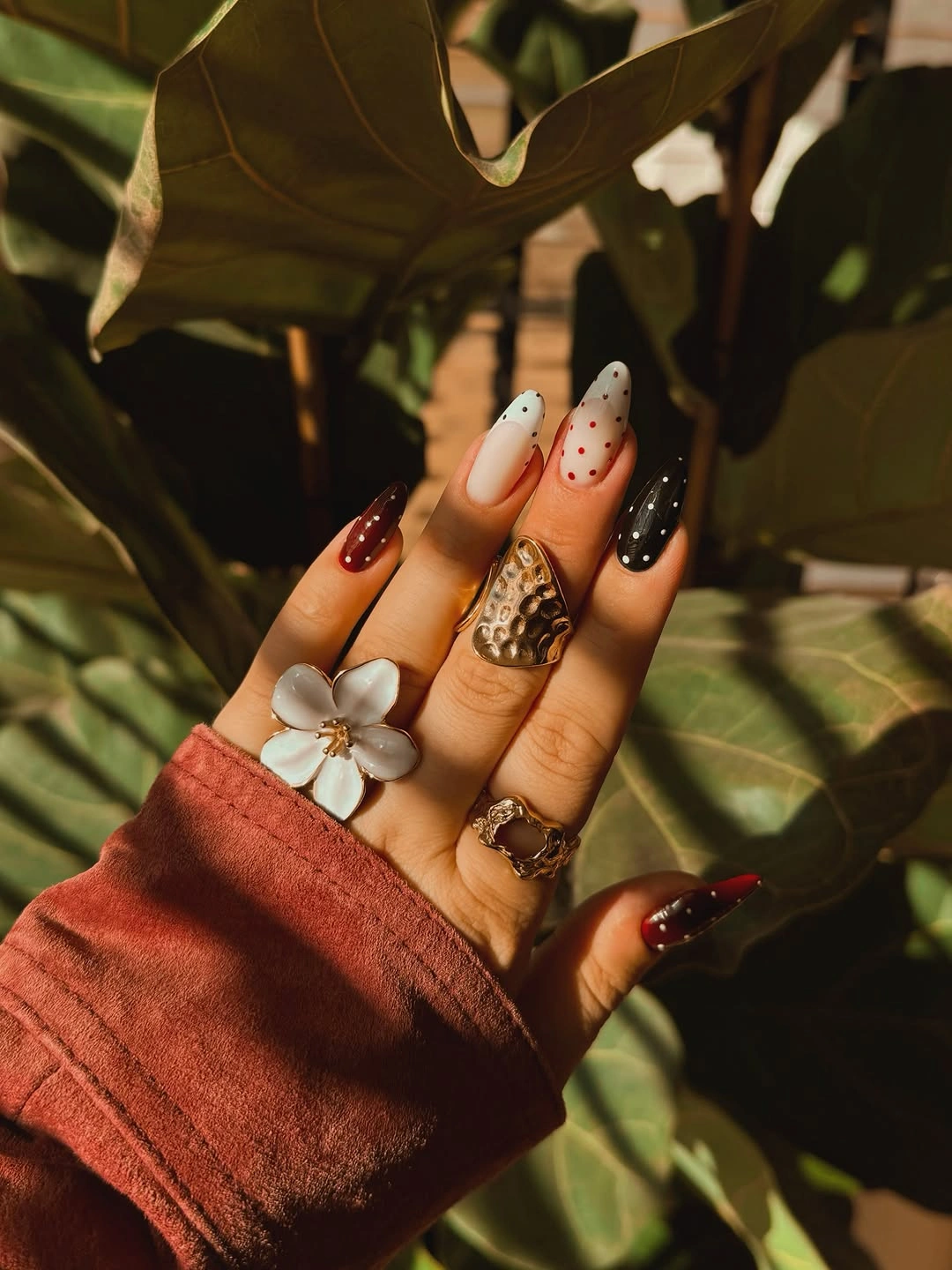 trendy fall nails for olive skin tone 2026 burgundy polka dot manicure